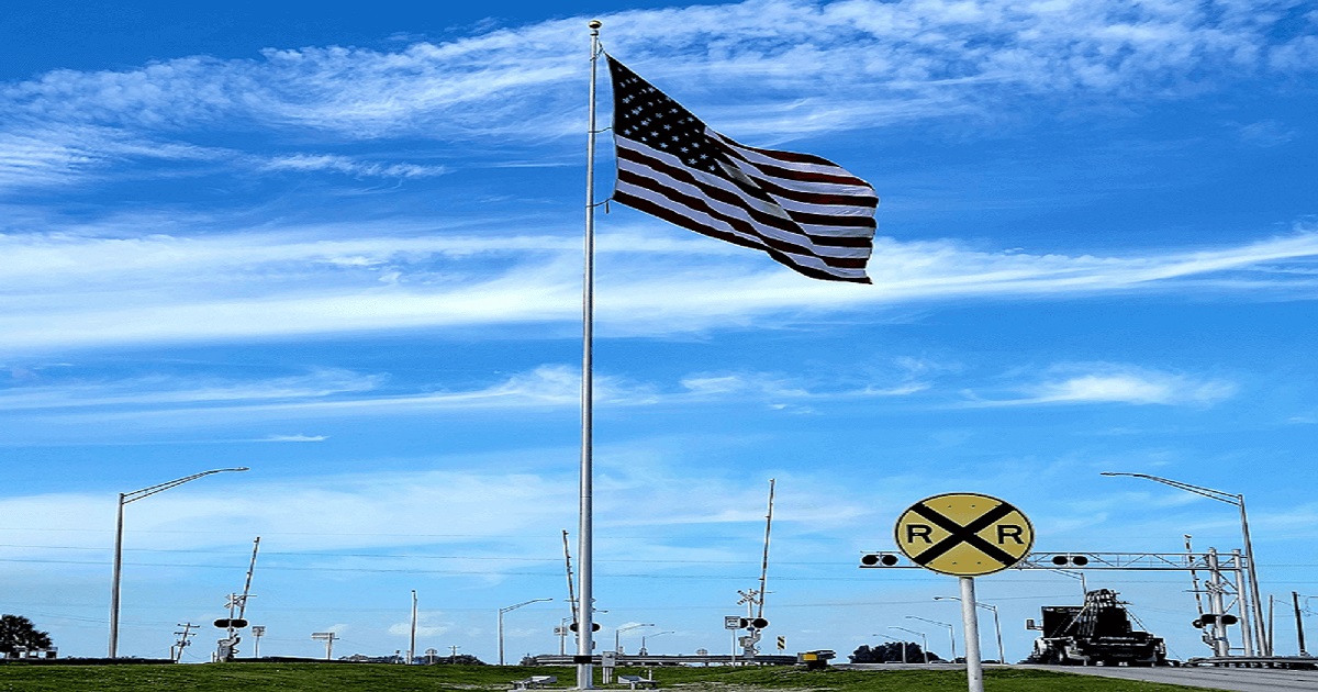 Professional home inspector examining a Clewiston Florida property near Lake Okeechobee for wind mitigation and structural issues