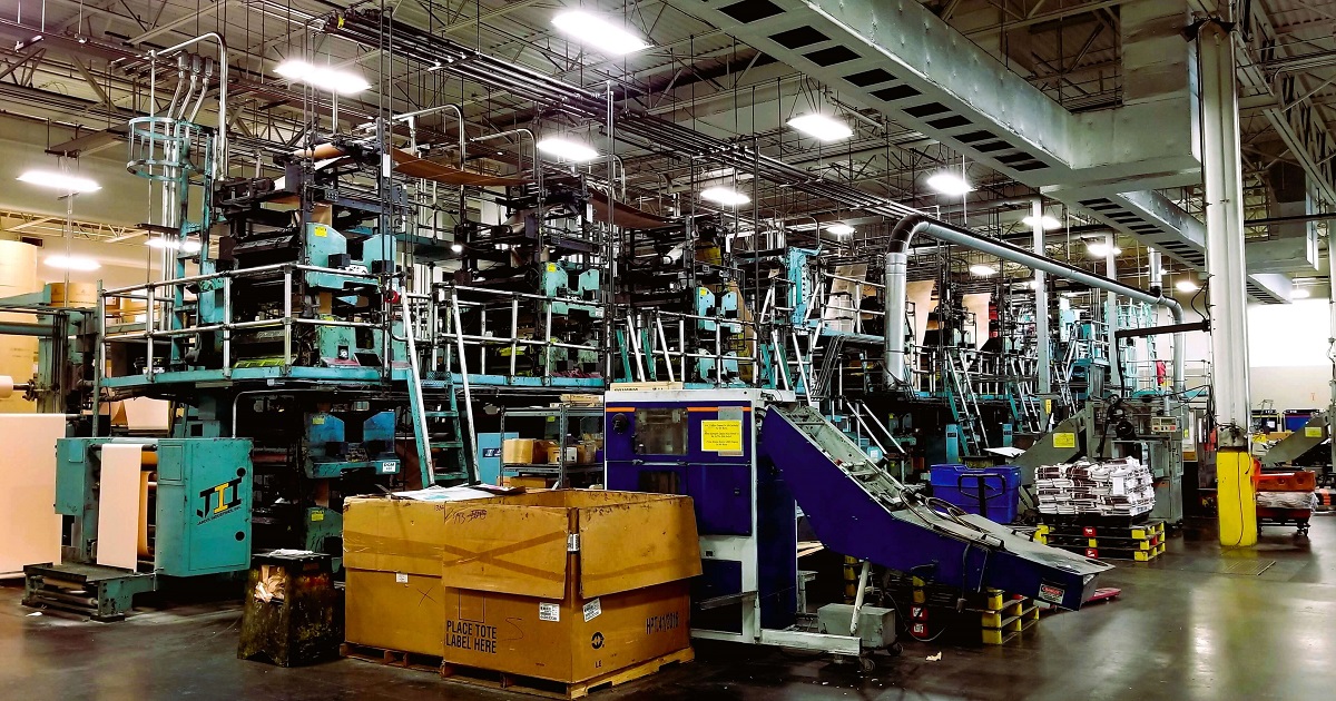 Inspector reviewing plans at a commercial building site