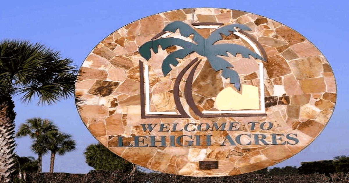 Professional home inspector examining a Lehigh Acres Florida property for wind mitigation and structural issues